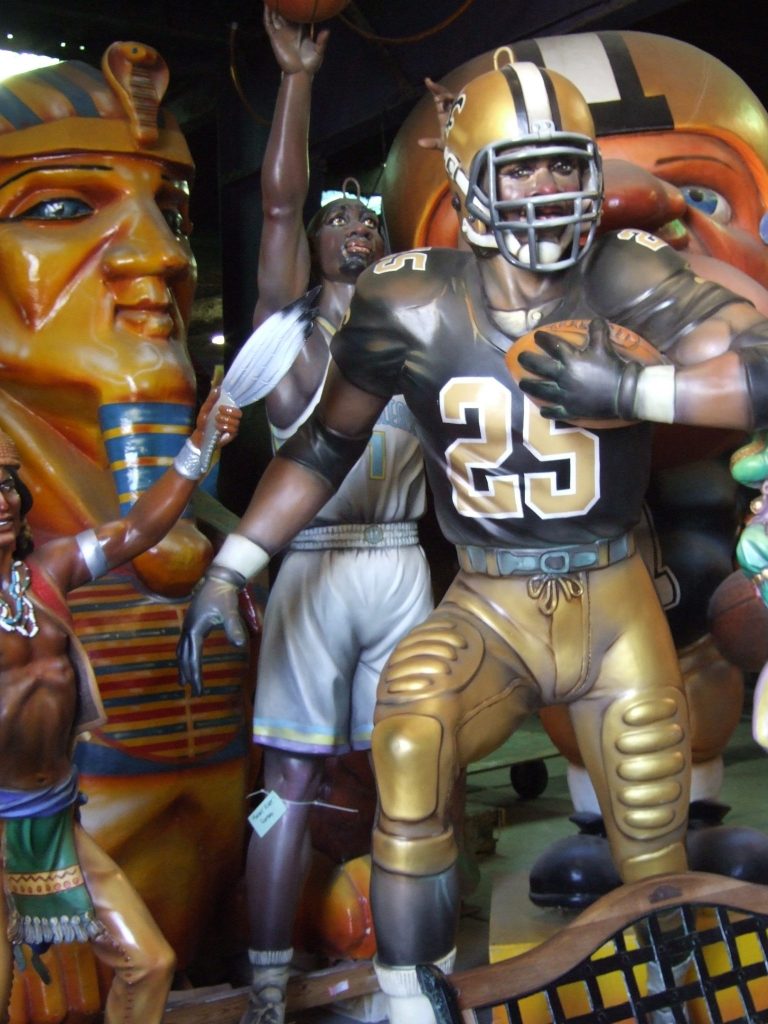 Reggie Bush Mardi Gras statue in New Orleans where maque choux is a popular dish