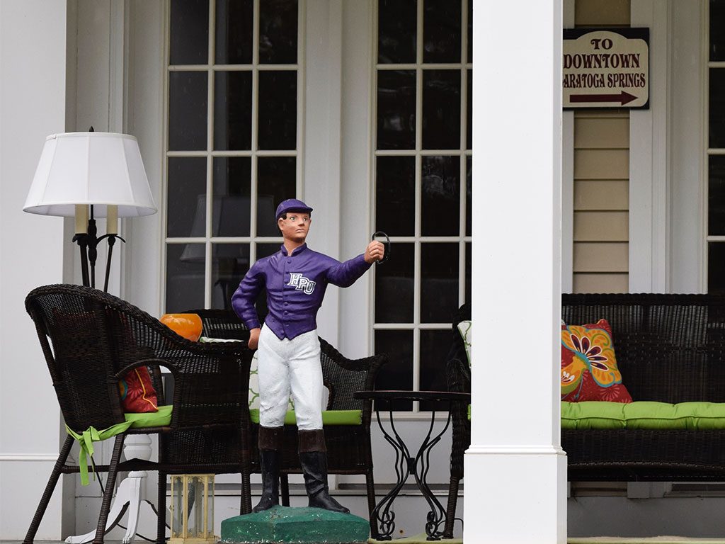 Porch jockey in Saratoga Springs NY - things to do in Saratoga Springs include photographing the great architecture