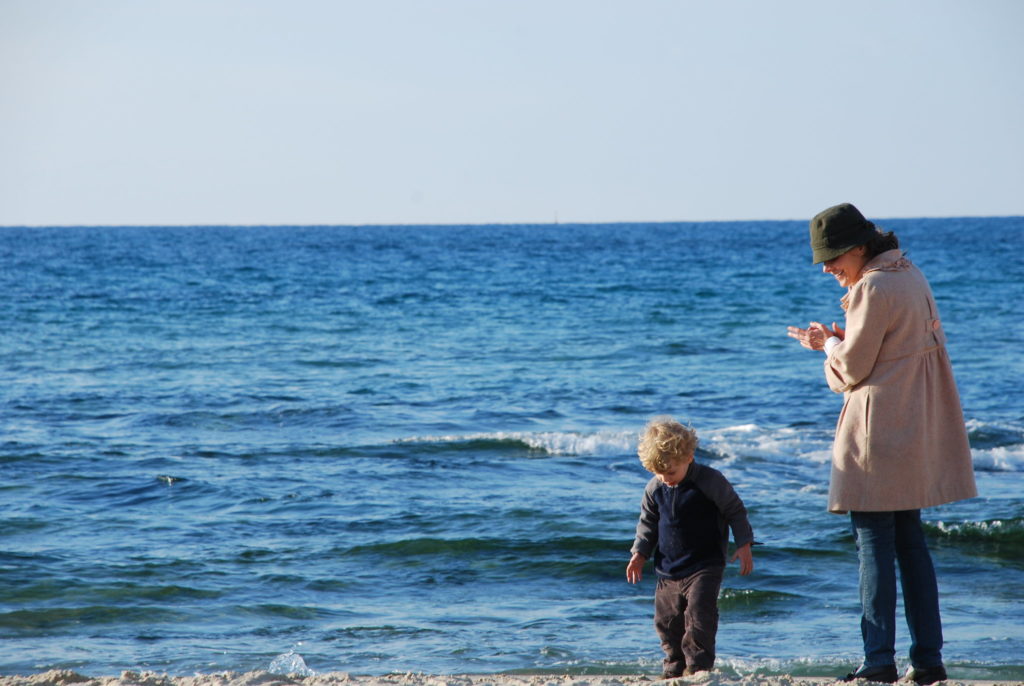 Mother and son on a beach in Israel