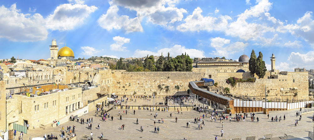 western wall in Israel with dome of the rock in the background