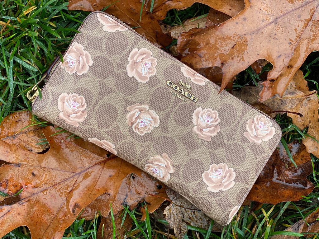 coach floral wallet in leaves