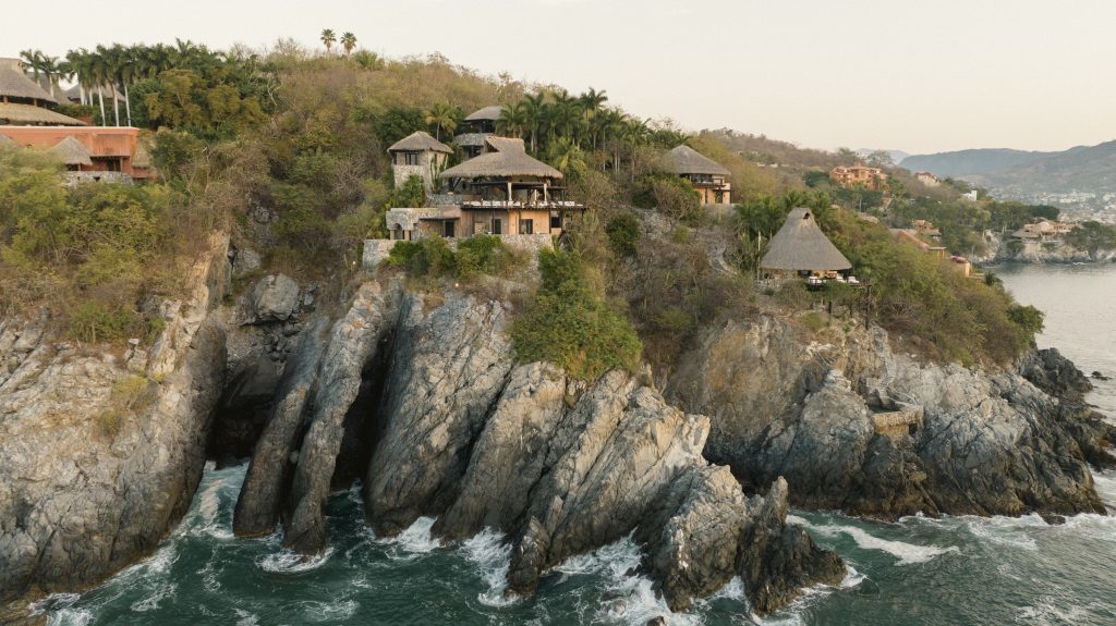 ZihFit resort buildings perched on a Pacific Coast cliff in Mexico.