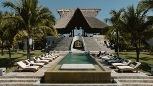 Outdoor swimming pool at ZihFit, a luxury wellness resort in Mexico