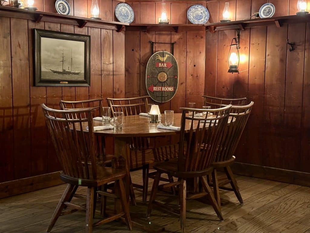 Wood paneled walls and oval dining table in the Beekman Arms Tavern in Rhinebeck.